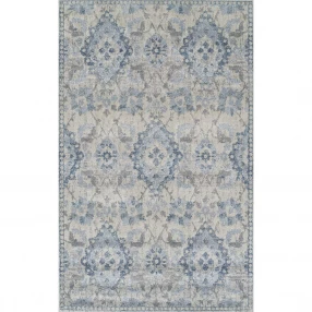 blue oriental area rug with beige and electric blue symmetrical pattern and motif