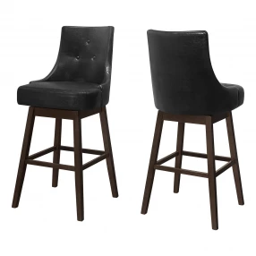 Set of Two 29" Black And Brown Faux Leather And Solid Wood Swivel Bar Height Bar Chairs