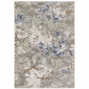 8' X 11' Grey Blue Ivory Brown And Navy Abstract Power Loom Stain Resistant Area Rug