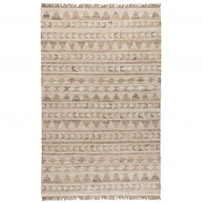 blue geometric hand woven area rug with brown and beige pattern on wooden floor