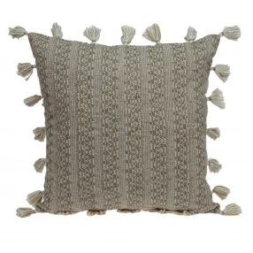 Neutral sand woven throw pillow with patterned design and artistic fabric texture