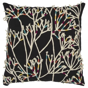 Black cream impressionistic branch design throw pillow with floral and plant patterns