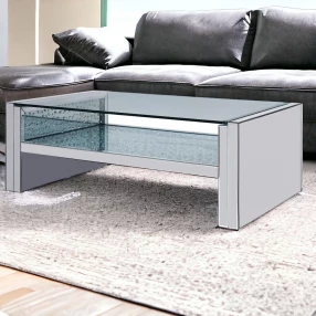 47" Clear And Silver Glass Mirrored Coffee Table With Shelf