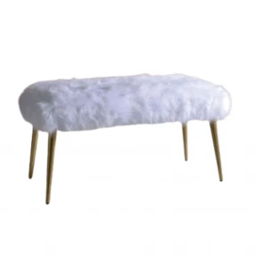 White gold upholstered faux fur bench with electric blue and magenta accents in an outdoor setting