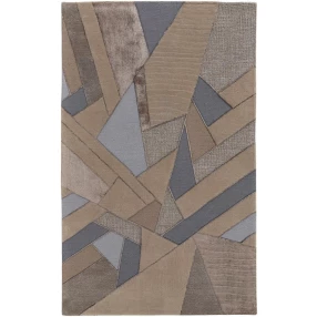 wool geometric tufted handmade area rug in brown beige and grey with triangle patterns on wood flooring