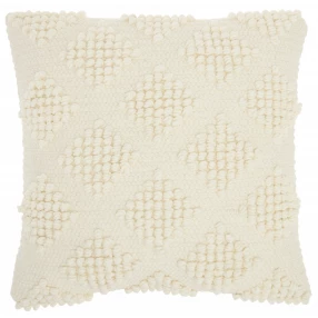 ivory textured diamonds throw pillow on beige tablecloth with artistic design