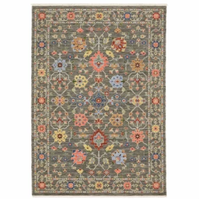 8' X 11' Grey Salmon Pink Gold Blue Rust Deep Blue Ivory And Green Oriental Power Loom Stain Resistant Area Rug With Fringe