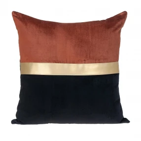 Gold black tufted velvet square pillow with patterned throw pillow on wood linen background